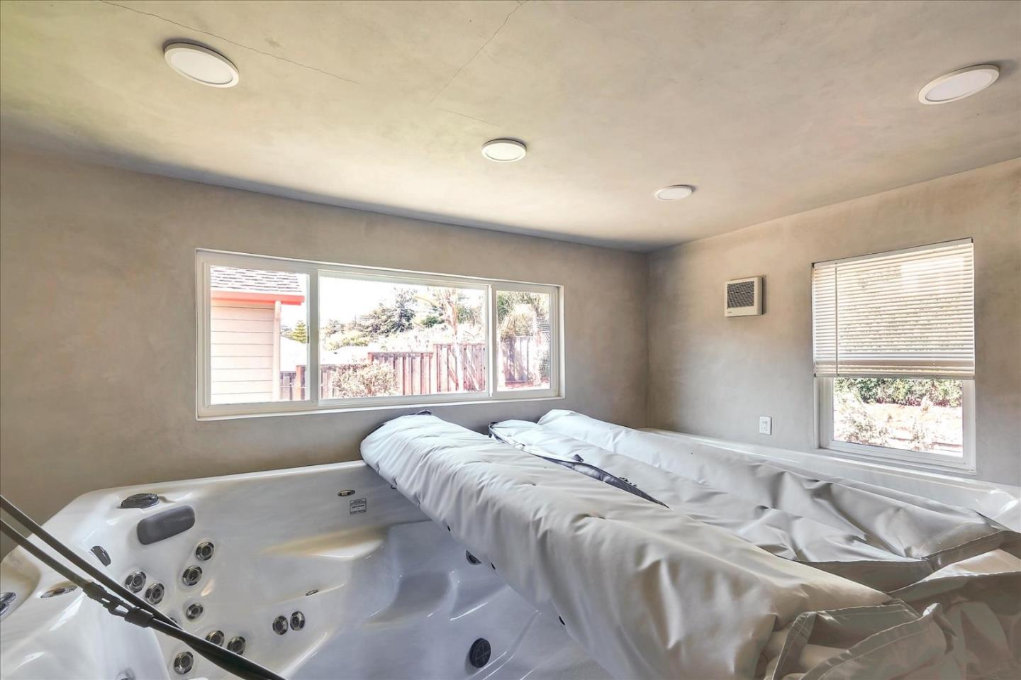 7128 Danko Drive Aptos, CA 95003 - Photo 40 of 47 a bed sitting in a bedroom next to a window