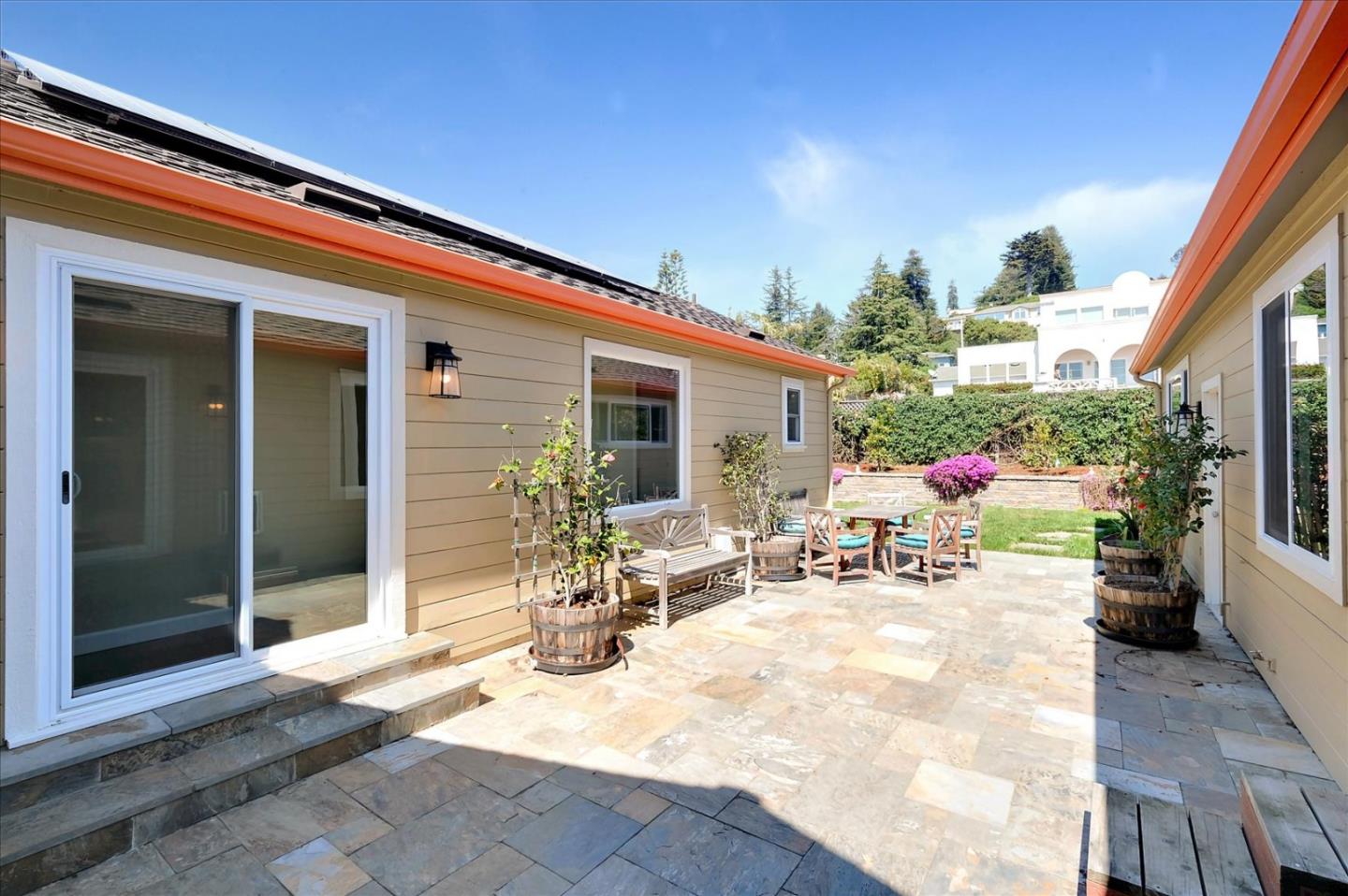 7128 Danko Drive Aptos, CA 95003 - Photo 42 of 47 a view of a patio with table and chairs and potted plants
