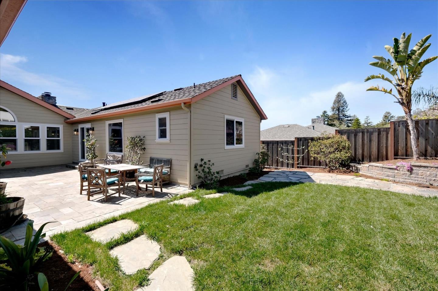 7128 Danko Drive Aptos, CA 95003 - Photo 44 of 47 a view of a house with backyard sitting area and garden