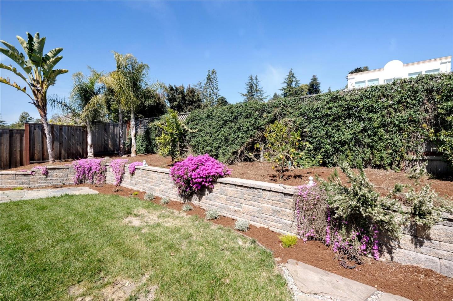 7128 Danko Drive Aptos, CA 95003 - Photo 46 of 47 a view of a white house with a yard and potted plants