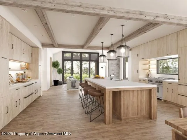 an aerial view of a city with lots of residential buildings ocean and mountain view in back