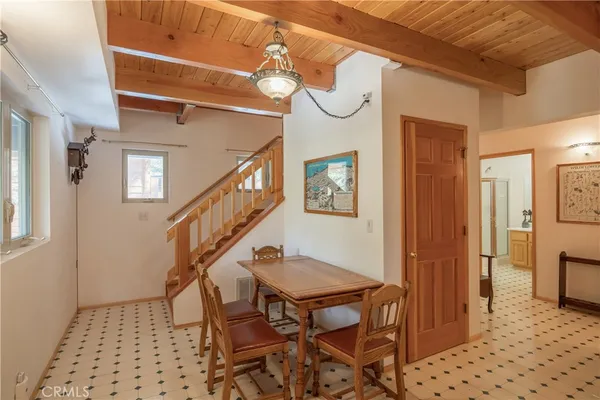 a view of entryway and hall with a dining table