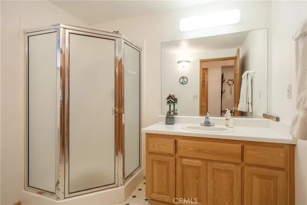 a bathroom with a mirror a sink and a mirror
