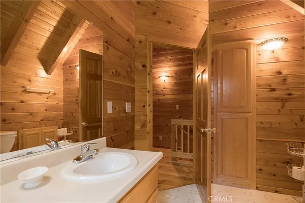 a bathroom with a shower and a sink