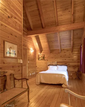 a view of a balcony with chair and wooden floor