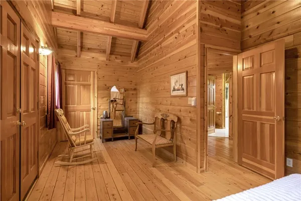 a view of a lobby with chair and wooden floor