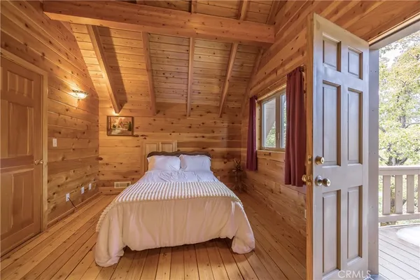 a view of balcony with a wooden floor and fence