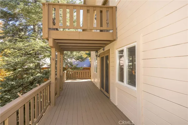 a view of balcony with wooden floor