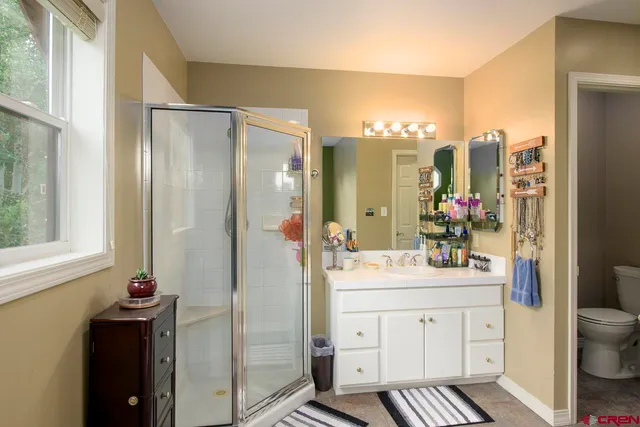 a bedroom with a bed and a walk in closet