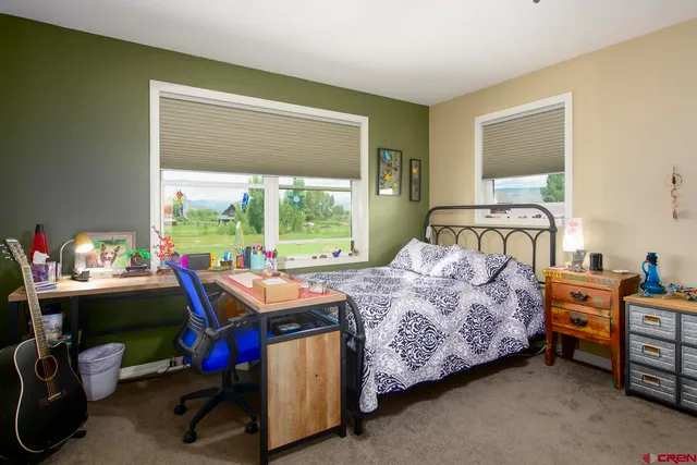 a swimming pool in front of the house