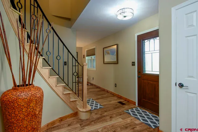a bed room with a bed and a view of kitchen