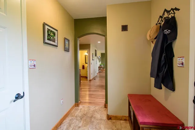 a kitchen with kitchen island granite countertop a stove and a sink