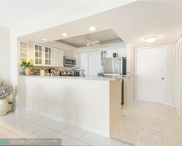 a kitchen with a stove a sink and a microwave