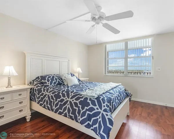 a bedroom with a large bed and a dresser