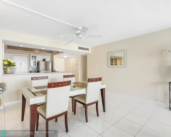 a dining room with a table and chairs