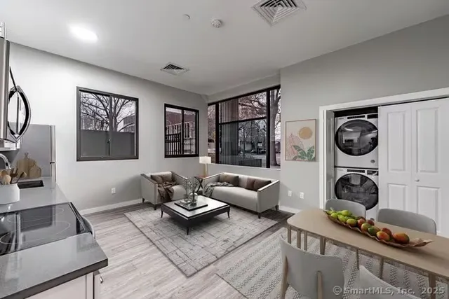 a living room with furniture and a window