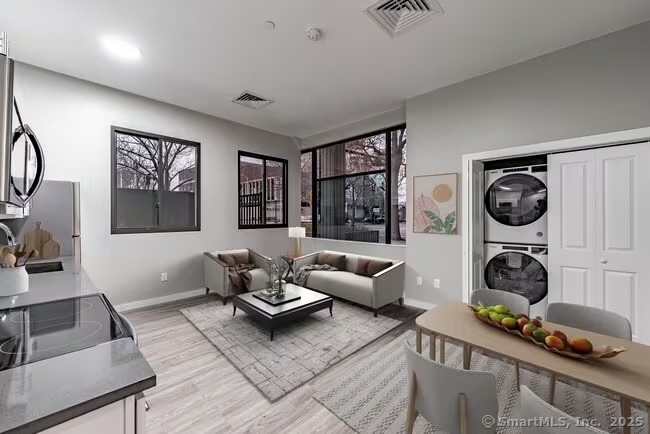 a living room with furniture and a window