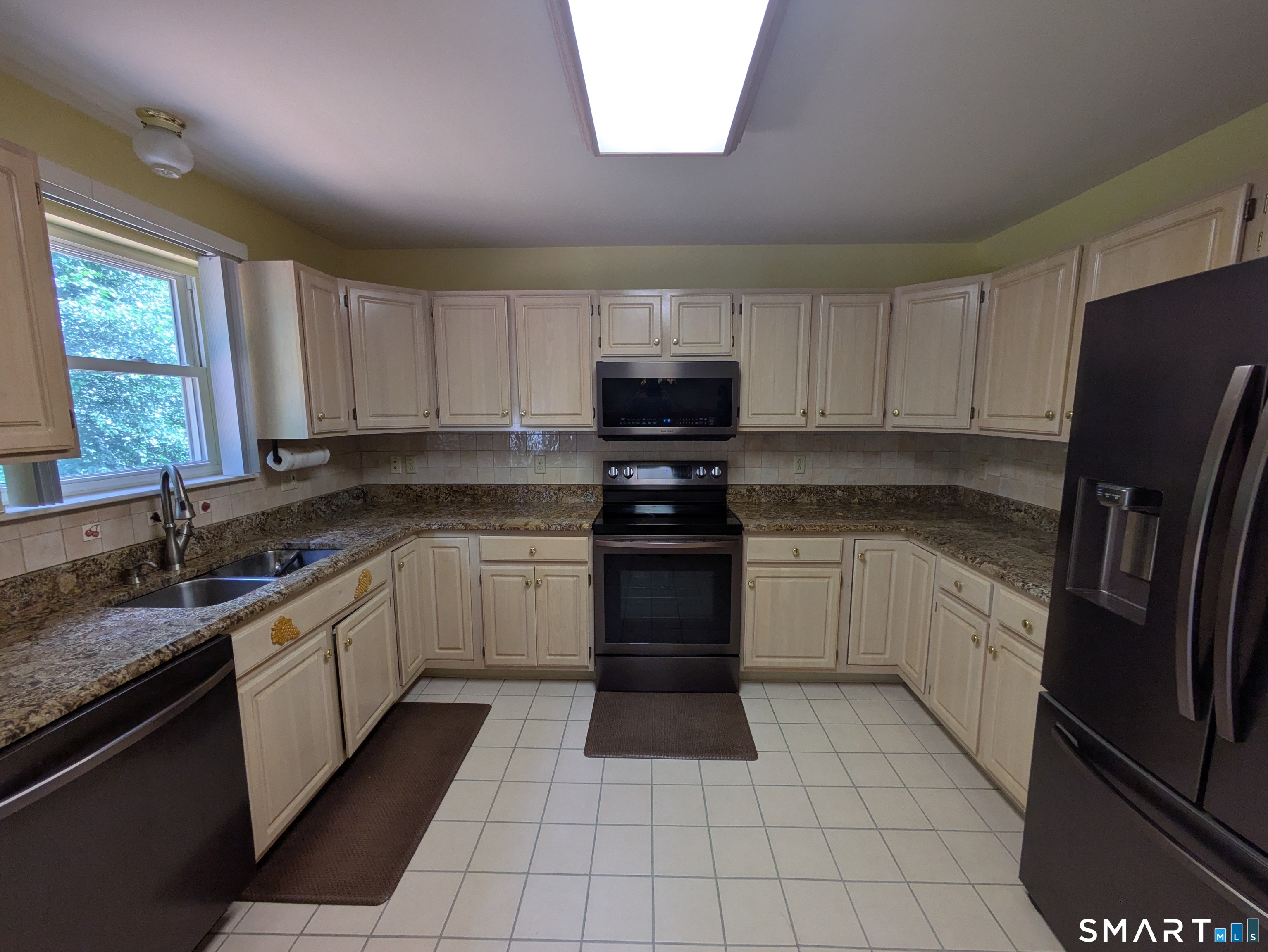 61 Basking Brook Road Shelton, CT 06484 - Photo 7 of 25 a kitchen with a sink stove and refrigerator