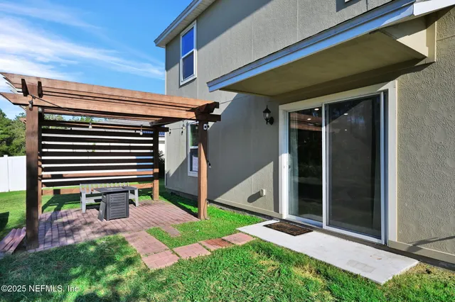 a backyard of a house with lots of green space
