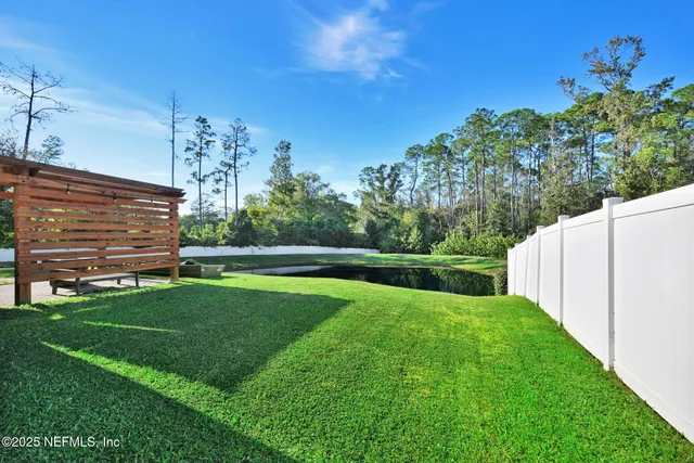 a view of a house with a back yard