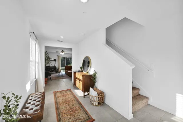 a living room with furniture and a rug