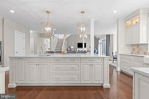 a bedroom with a large bed and flat tv screen on dresser