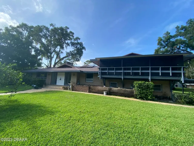 a kitchen with sink and refrigerator