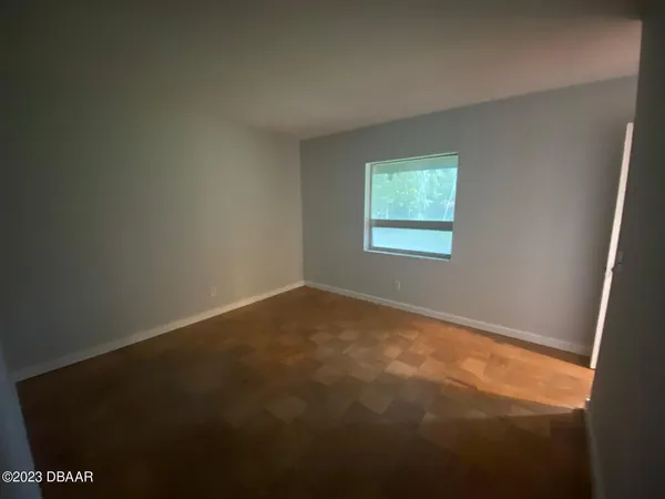 a view of a hallway with a chandelier