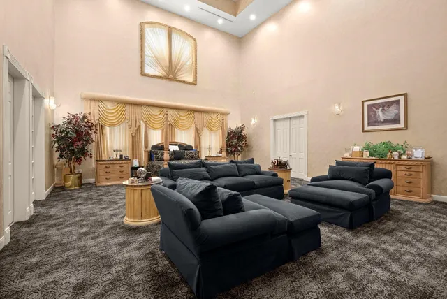 a bed room with furniture and a fireplace