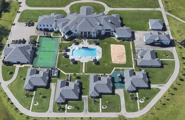an aerial view of a house with outdoor space