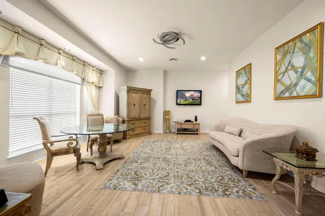 a living room with furniture or couch and a wooden floor