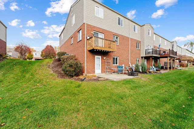 a view of a building with a yard