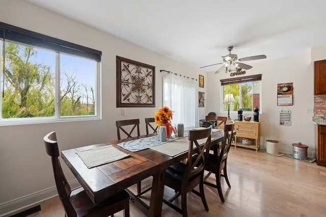 a view of a dining room with furniture window and wooden floor