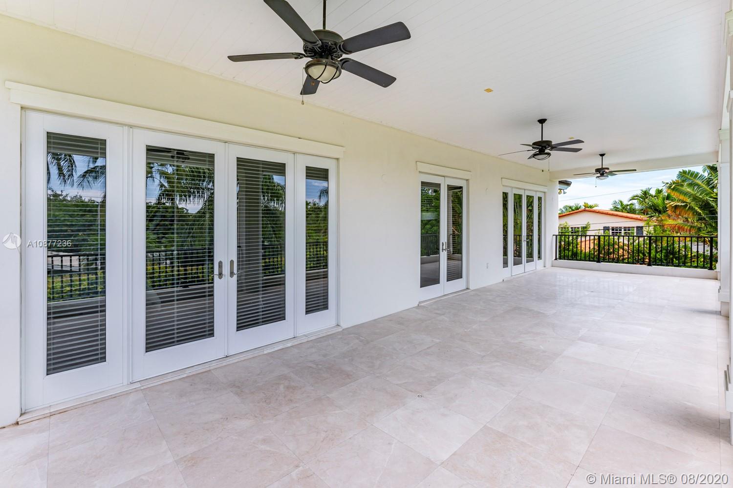 7260 Southwest 119th Street Pinecrest, FL 33156 - Photo 26 of 40 a view of a big room with windows