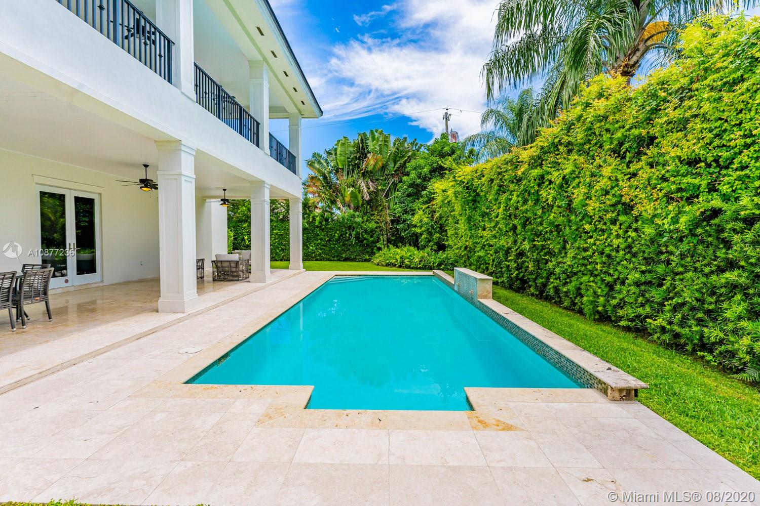 7260 Southwest 119th Street Pinecrest, FL 33156 - Photo 35 of 40 a view of an swimming pool with an outdoor seating