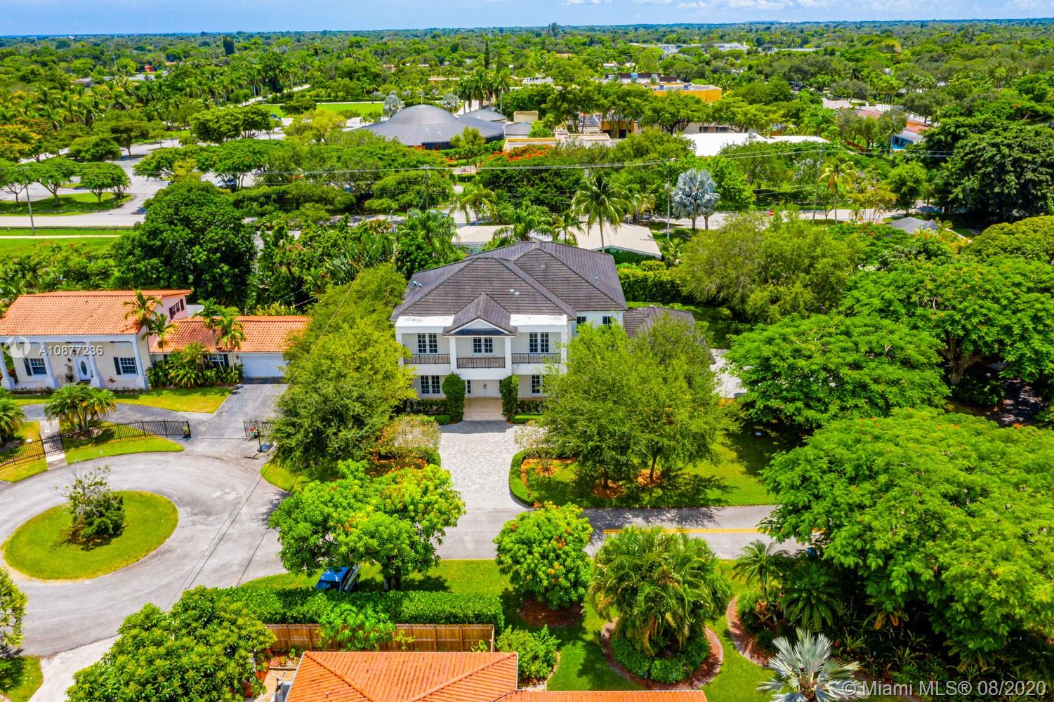7260 Southwest 119th Street Pinecrest, FL 33156 - Photo 37 of 40 an aerial view of residential houses with outdoor space and trees all around