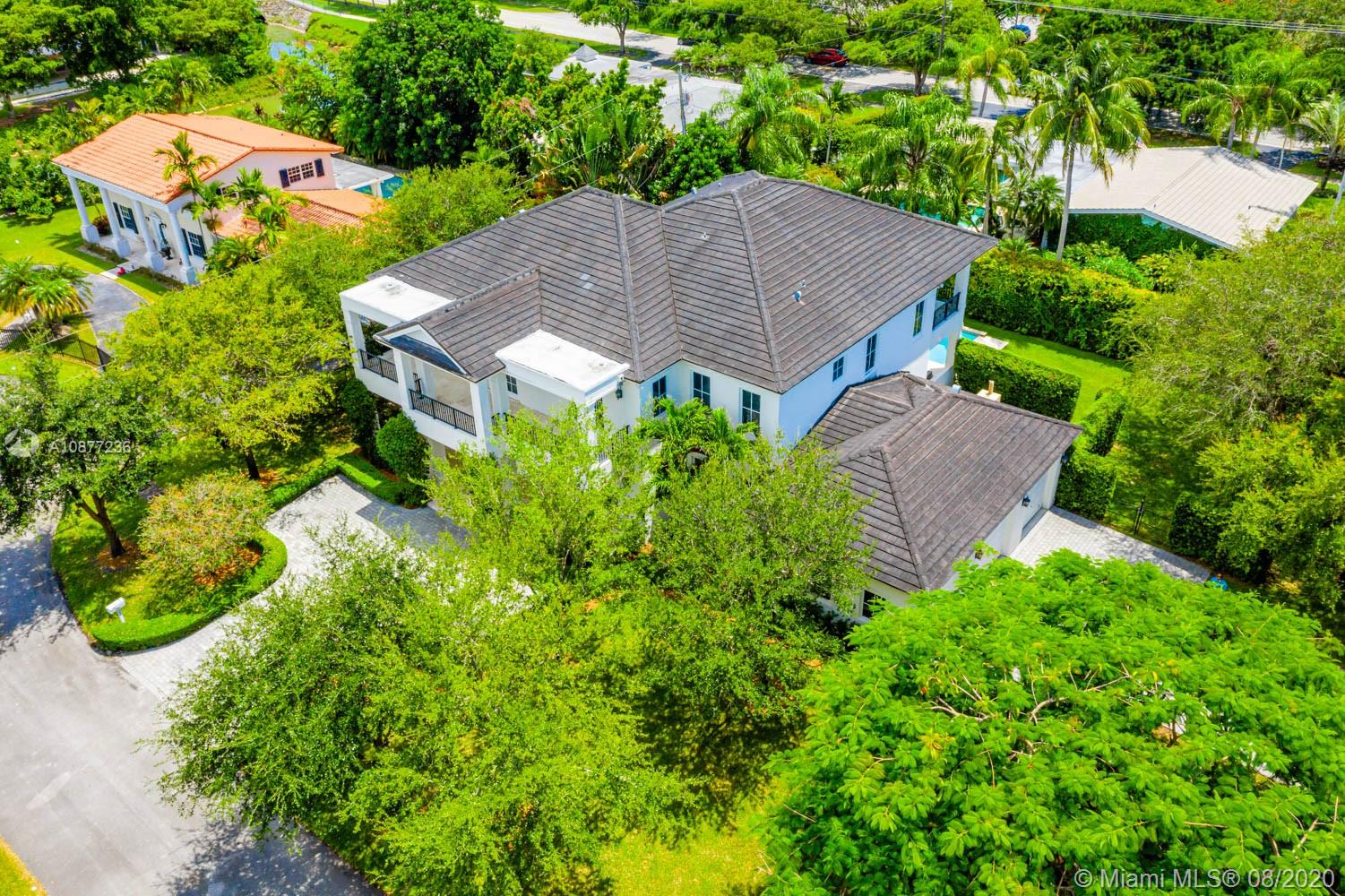 7260 Southwest 119th Street Pinecrest, FL 33156 - Photo 38 of 40 an aerial view of a house with yard and outdoor seating