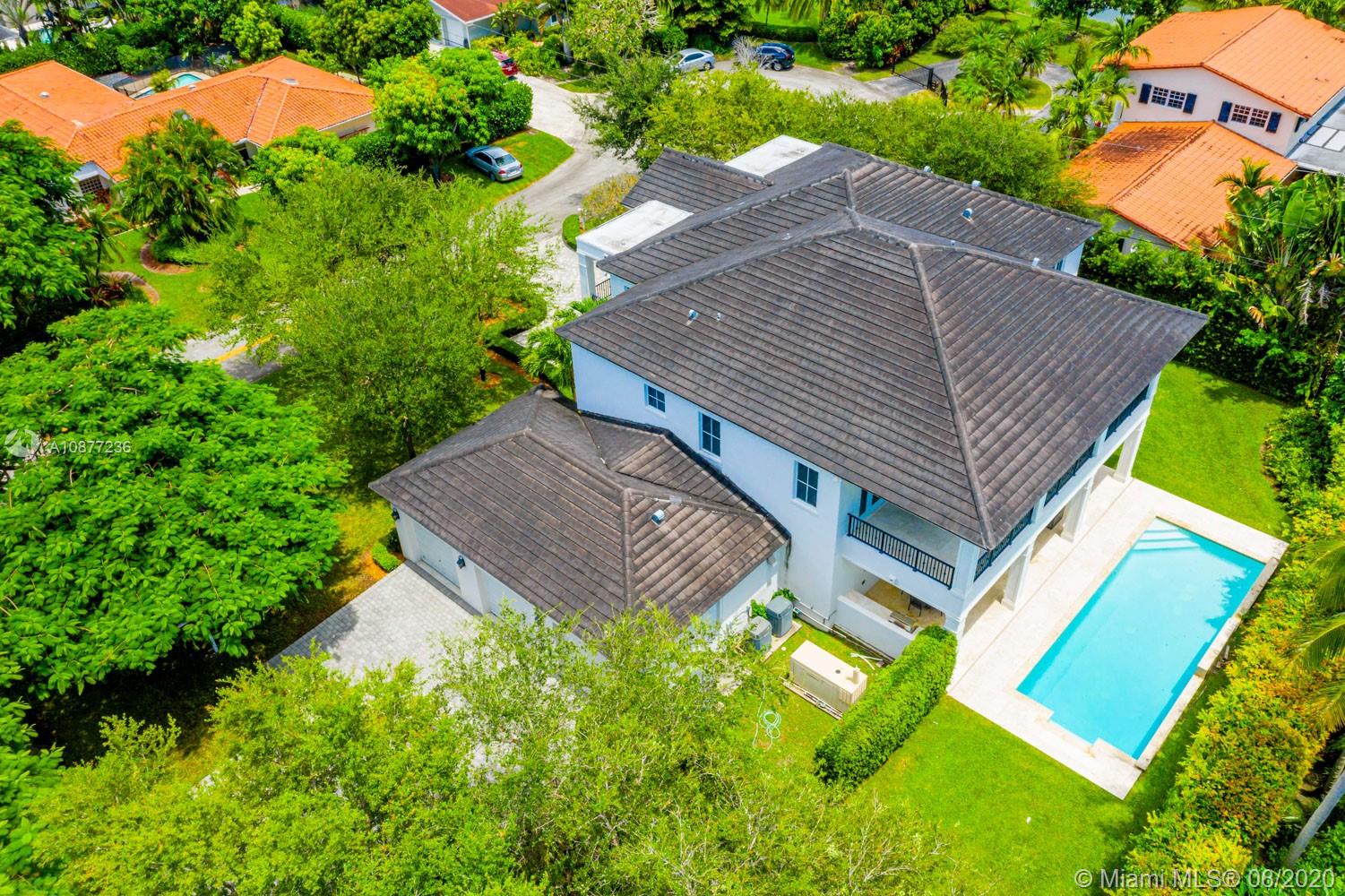 7260 Southwest 119th Street Pinecrest, FL 33156 - Photo 39 of 40 an aerial view of a house with a yard and outdoor seating
