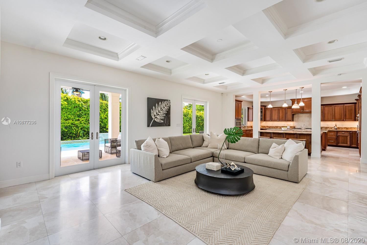 7260 Southwest 119th Street Pinecrest, FL 33156 - Photo 9 of 40 a living room with furniture and a large window