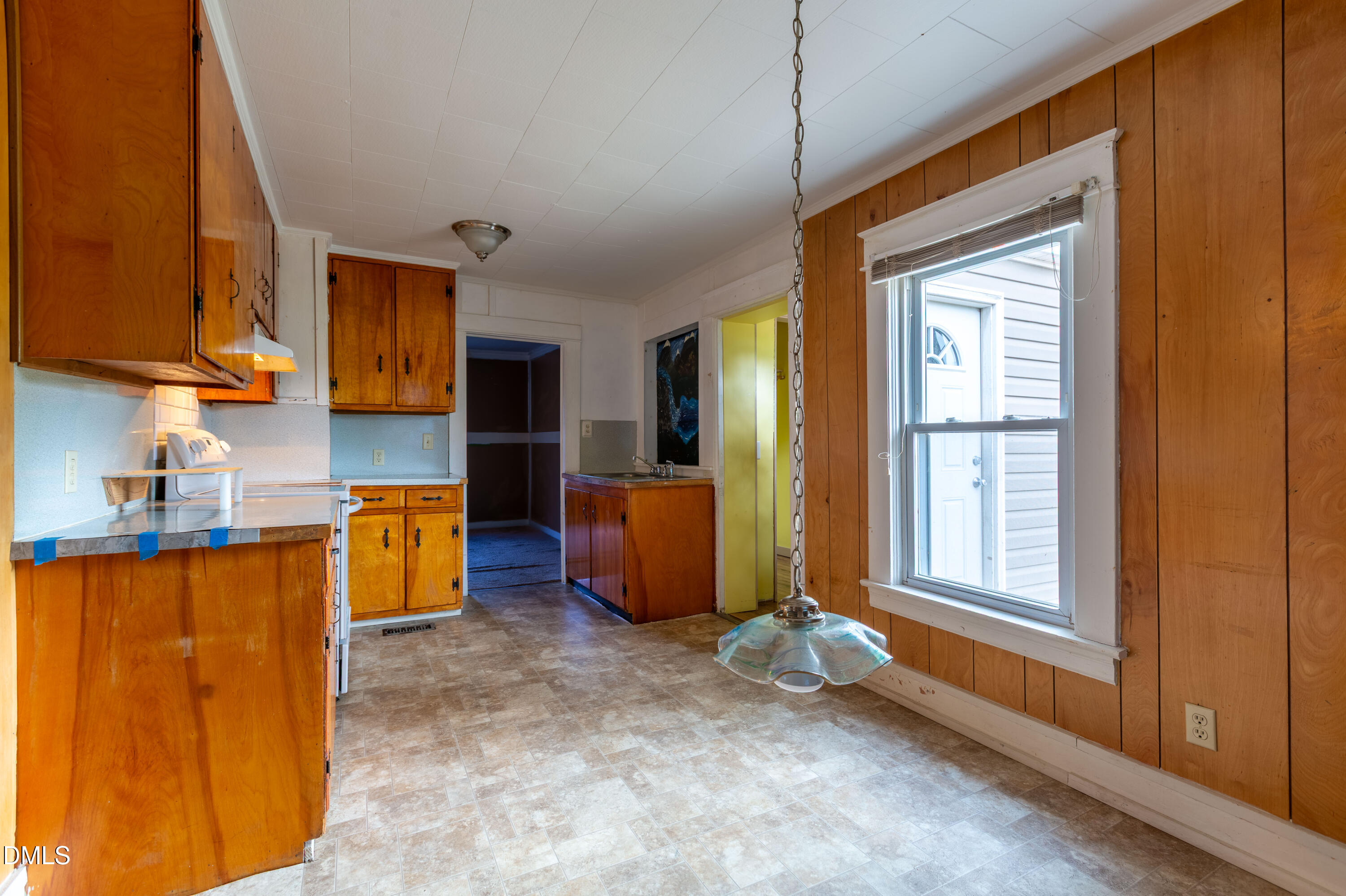 4295 Virgilina Road Roxboro, NC 27574 - Photo 17 of 46 a kitchen with sink refrigerator and window