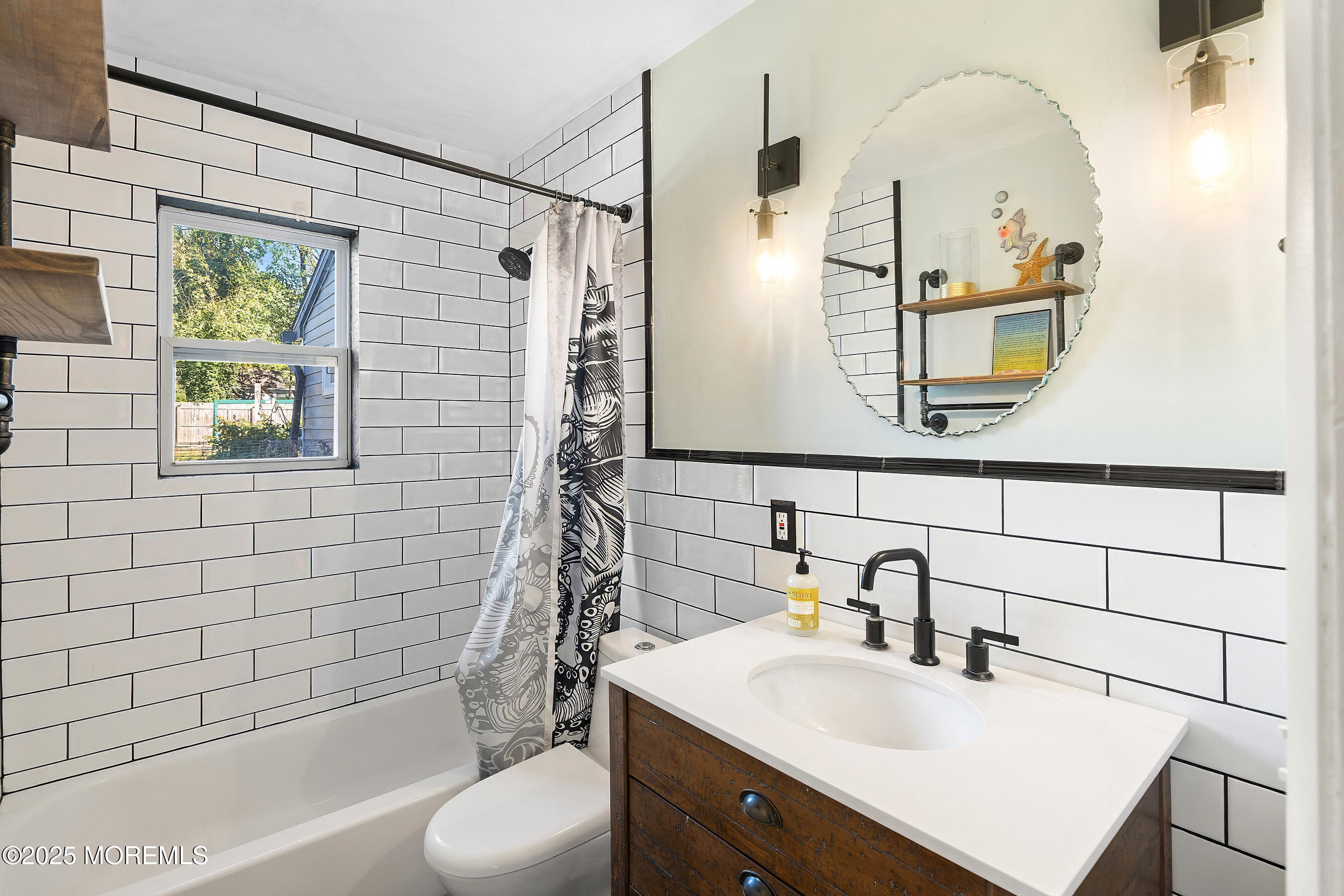 10 Marion Avenue Howell, NJ 07731 - Photo 12 of 26 a bathroom with a sink vanity mirror and tub