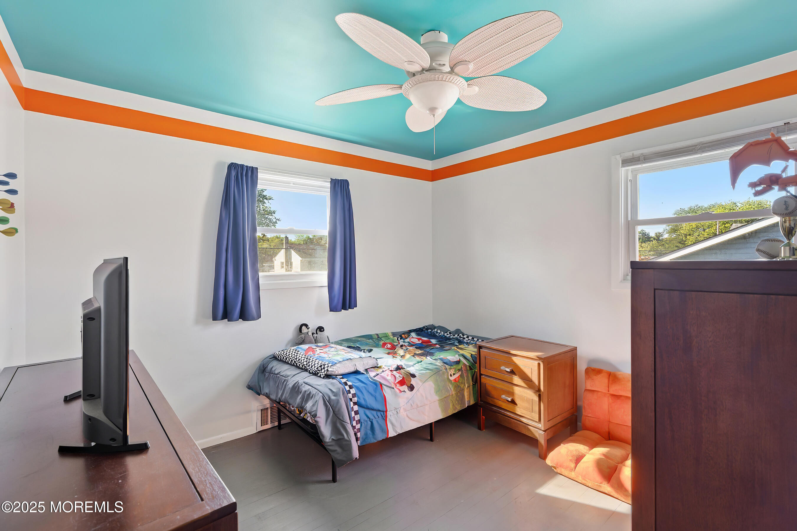 10 Marion Avenue Howell, NJ 07731 - Photo 14 of 26 a bedroom with a bed and a chandelier