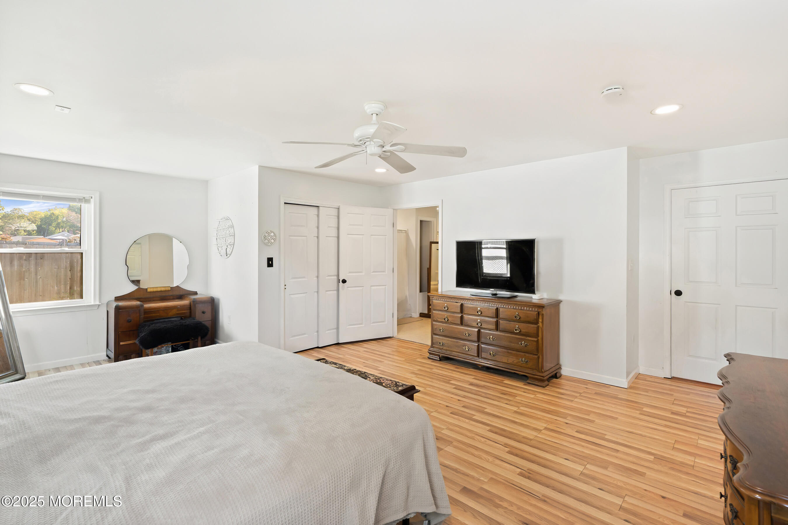 10 Marion Avenue Howell, NJ 07731 - Photo 17 of 26 a bedroom with a bed and a flat screen tv