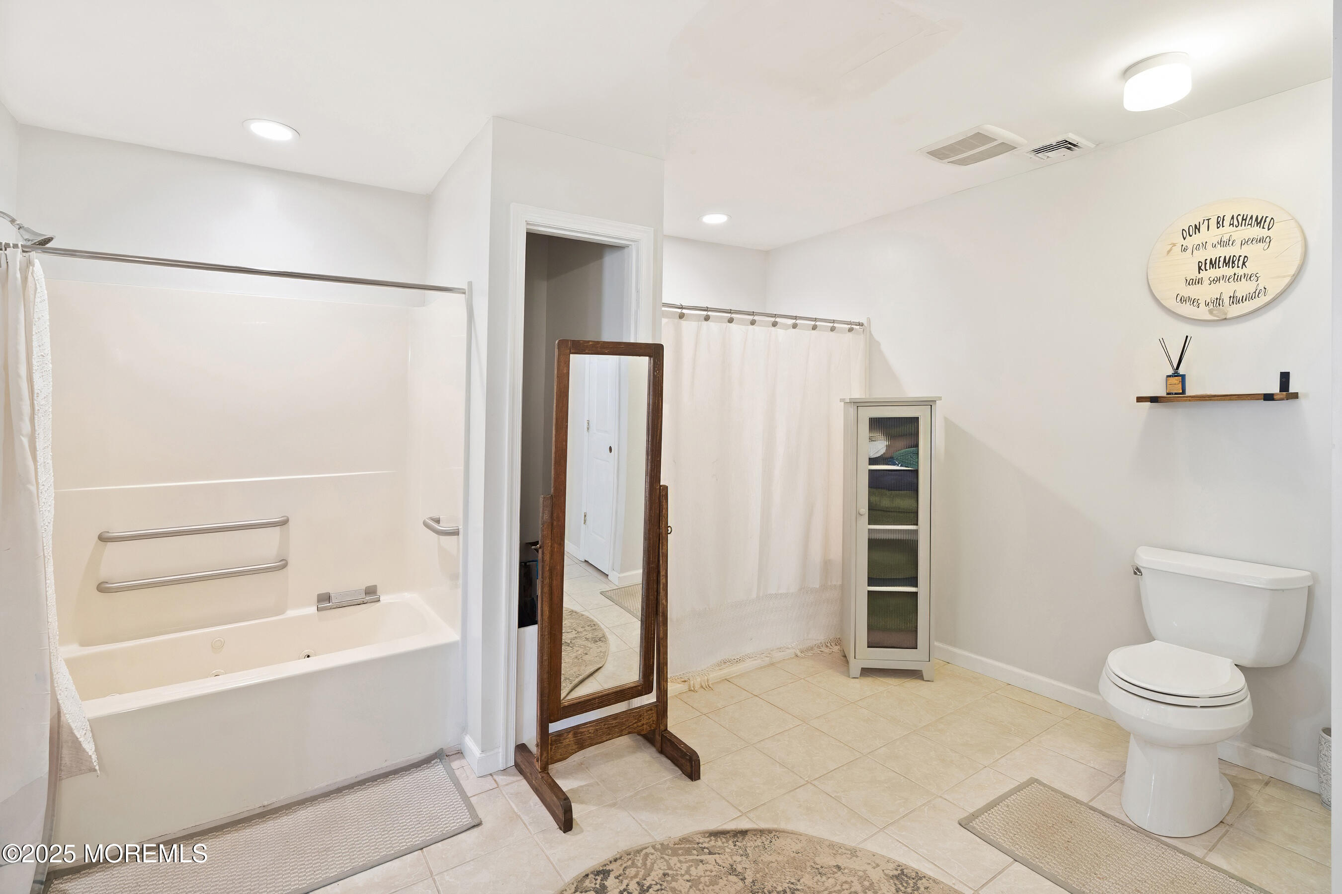 10 Marion Avenue Howell, NJ 07731 - Photo 18 of 26 a bathroom with a toilet a sink and shower