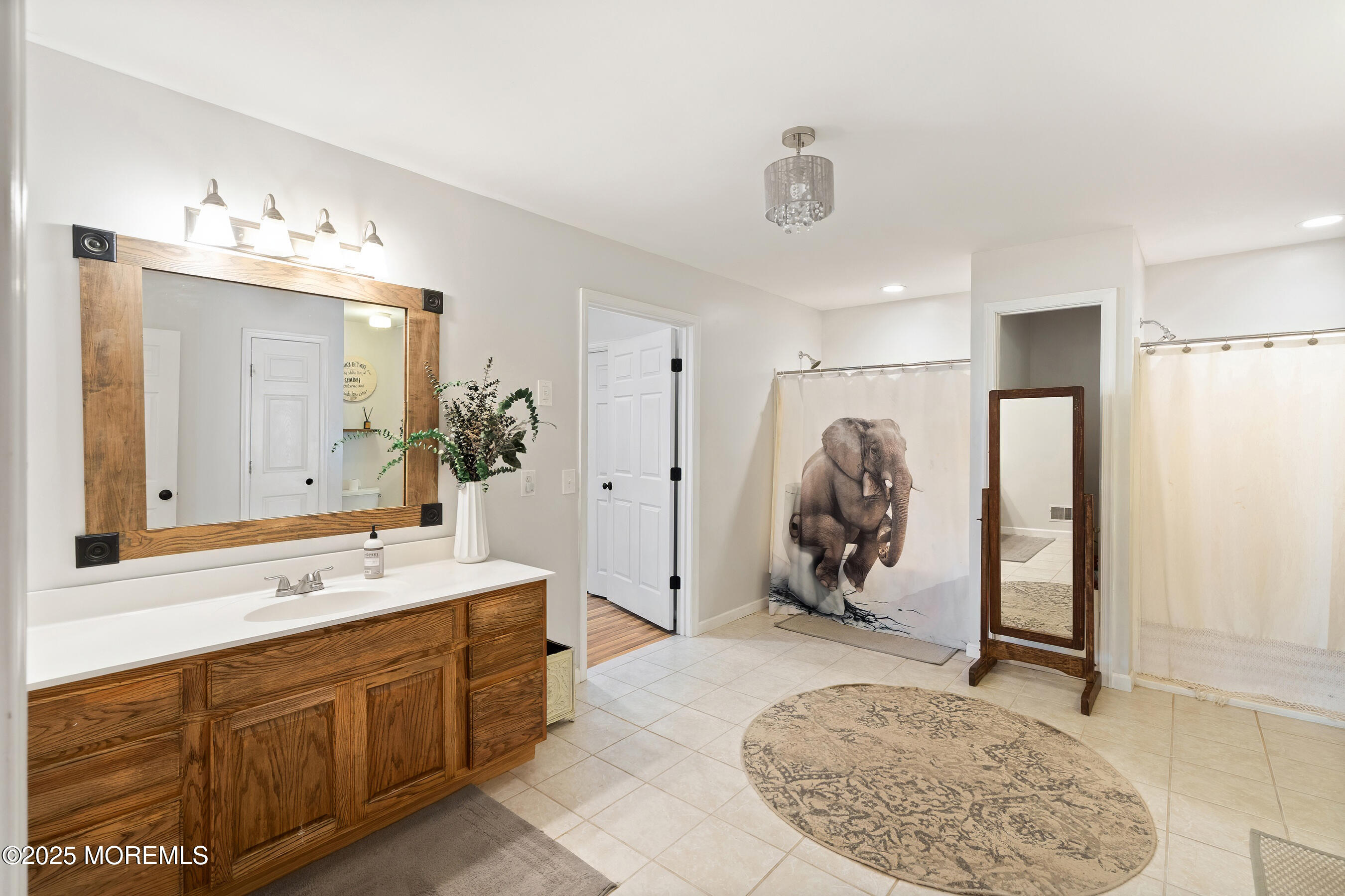 10 Marion Avenue Howell, NJ 07731 - Photo 19 of 26 a bathroom with a sink double vanity and a mirror