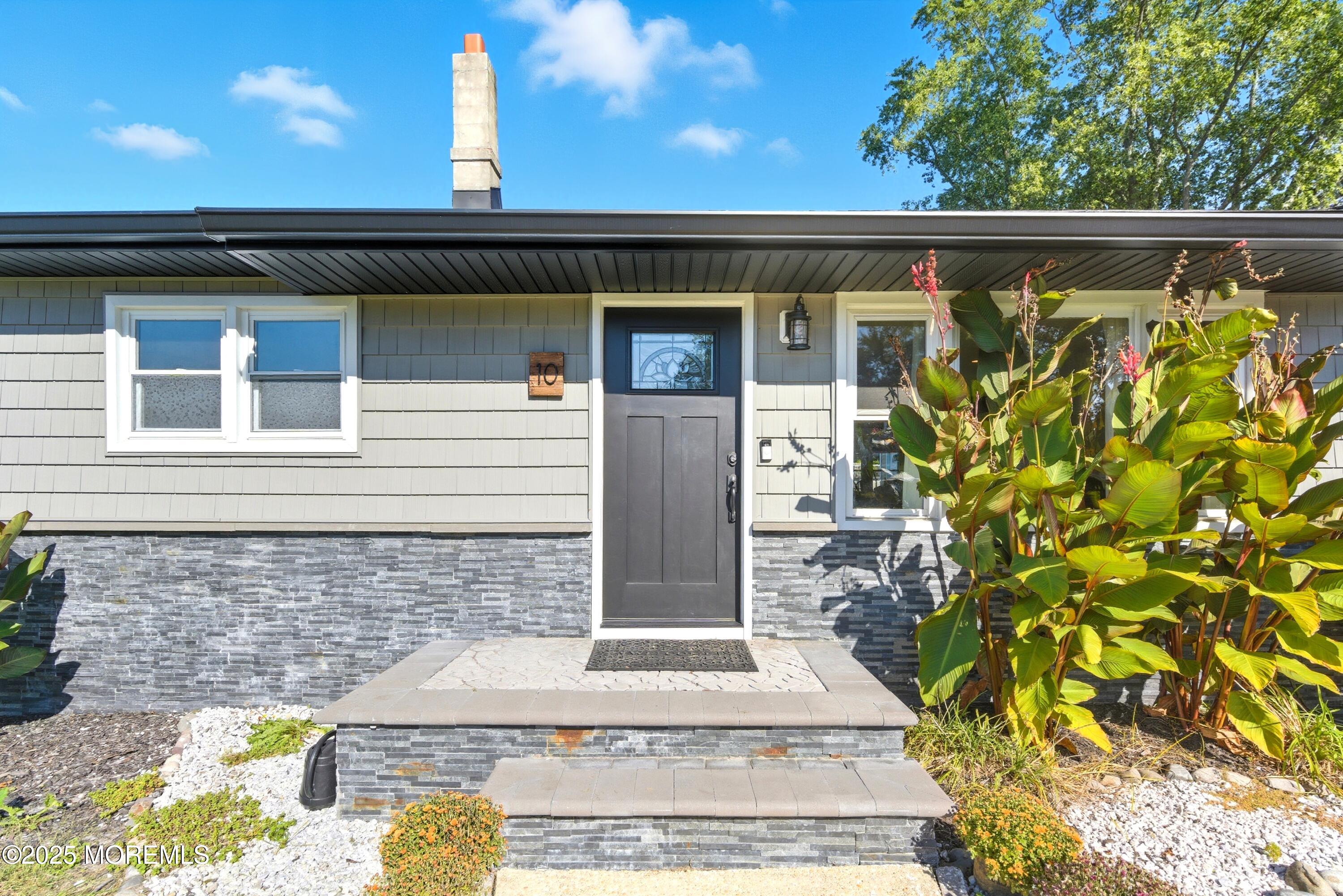 10 Marion Avenue Howell, NJ 07731 - Photo 2 of 26 a front view of a house with garden