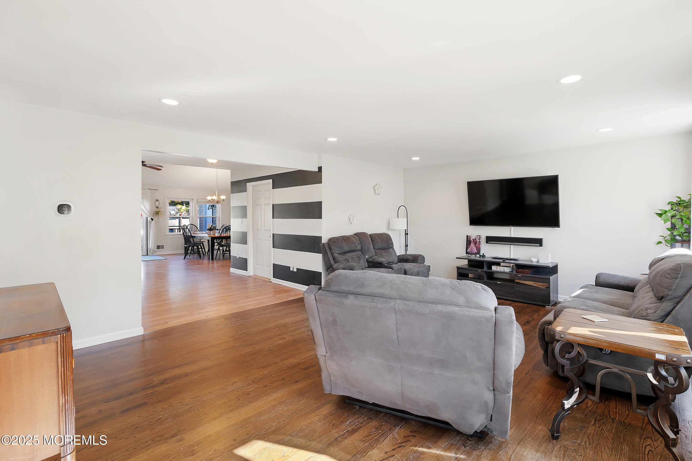 10 Marion Avenue Howell, NJ 07731 - Photo 3 of 26 a living room with furniture and a flat screen tv