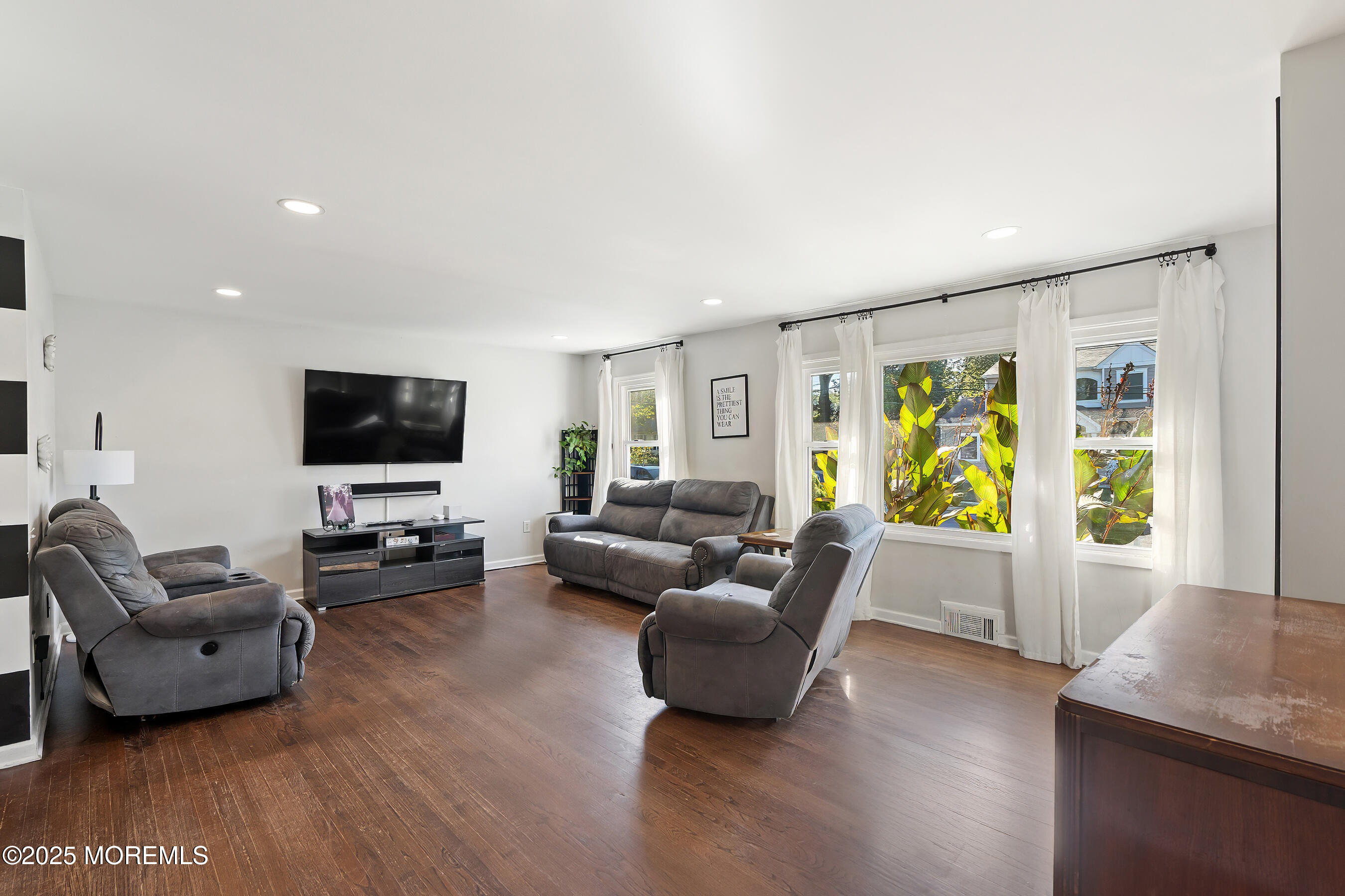 10 Marion Avenue Howell, NJ 07731 - Photo 4 of 26 a living room with furniture and a flat screen tv