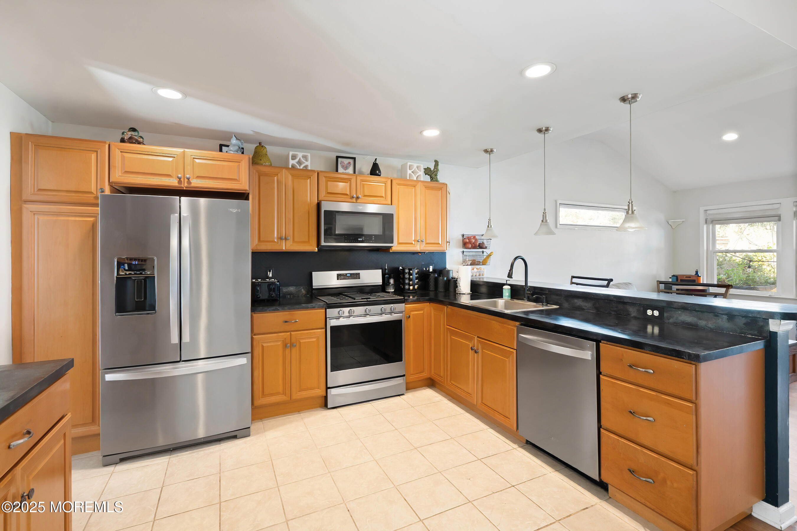 10 Marion Avenue Howell, NJ 07731 - Photo 6 of 26 a kitchen with stainless steel appliances granite countertop a refrigerator a sink a stove a washer and a refrigerator