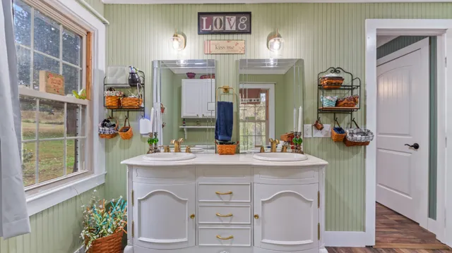 a view of kitchen with sink and refrigerator